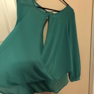 Green flowy, draped blouse.